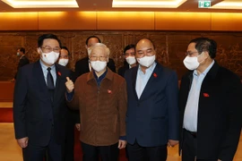 Tổng Bí thư Nguyễn Phú Trọng, Chủ tịch nước Nguyễn Xuân Phúc,Thủ tướng Chính phủ Phạm Minh Chính, Chủ tịch Quốc hội Vương Đình Huệ dự Kỳ họp thứ hai, Quốc hội khóa XV. (Ảnh: Trí Dũng/TTXVN) 