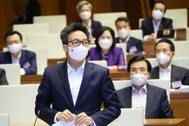 Phó Thủ tướng Chính phủ Vũ Đức Đam trả lời chất vấn, giải trình về những vấn đề có liên quan. (Ảnh: Văn Điệp/TTXVN