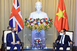 Chủ tịch nước Nguyễn Xuân Phúc tiếp Bộ trưởng thứ nhất, Bộ trưởng Bộ Ngoại giao và Phát triển Liên hiệp Vương quốc Anh và Bắc Ireland Dominic Raab đang thăm chính thức Việt Nam. (Ảnh: Thống Nhất/TTXVN)