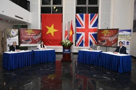 Hình ảnh buổi lễ ký kết tại Trường Quốc tế Việt Nam. (Nguồn: Vietnam+)