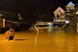 Mưa lớn gây ngập sâu trên nhiều khu vực ở huyện Bù Đăng (Bình Phước). (Ảnh: TTXVN phát)