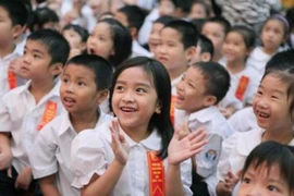 Học sinh tưng bừng trong lễ khai giảng. (Ảnh: Quý Trung/TTXVN)