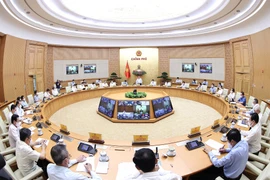 Quang cảnh cuộc họp về công tác phòng, chống dịch COVID-19 tại 19 tỉnh, thành phía Nam sau một thời gian áp dụng các biện pháp giãn cách xã hội. (Ảnh: Dương Giang/TTXVN)