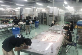 Việc thực hiện lưu trú giúp một số doanh nghiệp ở tỉnh Đồng Nai thực hiện 'mục tiêu kép.' (Ảnh: TTXVN)