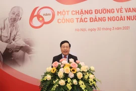 Ông Phạm Bình Minh, Ủy viên Bộ Chính trị, Phó Thủ tướng, Bí thư Ban Cán sự Đảng, Bộ trưởng Bộ Ngoại giao phát biểu tại buổi gặp mặt kỷ niệm 60 năm công tác Đảng ngoài nước. (Ảnh: Lâm Khánh/TTXVN)