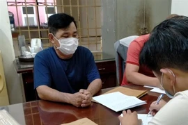 Đối tượng Phong tại cơ quan công an. (Ảnh: TTXVN)