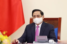  Thủ tướng Chính phủ Phạm Minh Chính điện đàm với Thủ tướng Thái Lan Prayut Chan-o-cha. (Ảnh: Dương Giang/TTXVN)