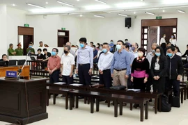 Các bị cáo tại phiên tòa. (Ảnh: Phạm Kiên/TTXVN)