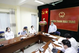 Tại điểm cầu phường Thanh Xuân Trung, quận Thanh Xuân, Thủ tướng Phạm Minh Chính làm việc trực tuyến với các xã, phường, thị trấn và thành phố Hà Nội về công tác phòng, chống dịch COVID-19. (Ảnh: Dương Giang/TTXVN)