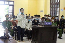 Các bị cáo tại phiên tòa xét xử ngày 25/8/2021. (Ảnh: Anh Tuấn/TTXVN)
