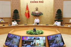 Thủ tướng Phạm Minh Chính chủ trì cuộc họp trực tuyến với lãnh đạo tỉnh Kiên Giang và Tiền Giang. (Ảnh: Dương Giang/TTXVN)