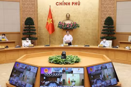 Thủ tướng Phạm Minh Chính chủ trì cuộc họp trực tuyến với lãnh đạo tỉnh Kiên Giang và Tiền Giang. (Ảnh: Dương Giang/TTXVN)