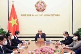 Chủ tịch nước Nguyễn Xuân Phúc điện đàm với Tổng thống Rumani Klaus Werner Iohannis. (Ảnh: Thống Nhất/TTXVN)