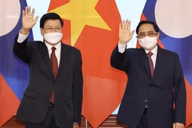 Thủ tướng Chính phủ Phạm Minh Chính hội kiến Tổng Bí thư Ban Chấp hành Trung ương Đảng Nhân dân Cách mạng Lào, Chủ tịch nước Cộng hòa Dân chủ Nhân dân Lào Thongloun Sisoulith thăm chính thức Việt Nam (28/6/2021). (Ảnh: Dương Giang/TTXVN)