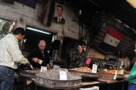 Người dân Syria được trở lại hoạt động thường nhật hàng ngày tại Damascus ngày 27/2, sau khi lệnh ngừng bắn có hiệu lực. (Nguồn: THX/TTXVN)