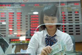 Giao dịch ngoại tệ tại LienVietPostBank. (Nguồn: CTV)