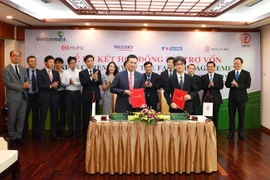 Đại diện hai bên tham gia ký kết. (Nguồn: Vietcombank)
