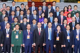 Chủ tịch nước Trần Đại Quang với các đại biểu tại buổi gặp mặt. (Ảnh: Nhan Sáng/TTXVN)