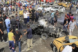 Hiện trường một vụ đánh bom ở Iraq. (Nguồn: AP)