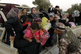 Người tị nạn Syria tới khu vực Ramtha sau khi qua biên giới Syria - Jordan ngày 5/9/2012. (Ảnh: AFP/ TTXVN)