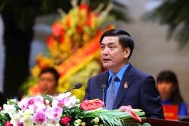 Chủ tịch Tổng Liên đoàn lao động Việt Nam Bùi Văn Cường trình bày Báo cáo của Ban Chấp hành Công đoàn khóa 11. (Ảnh; TTXVN)