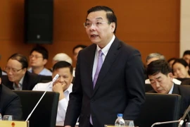 Bộ trưởng Bộ Khoa học và Công nghệ Chu Ngọc Anh trả lời chất vấn. (Ảnh: Nguyễn Dân/TTXVN)