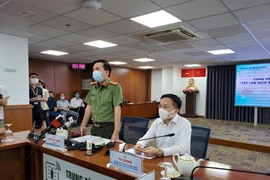Công an Thành phố cung cấp thông tin về việc khởi tố vụ án về vụ việc lây lan COVID-19 trong cộng đồng. (Ảnh: Thành Chung/TTXVN)
