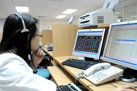 Hoạt động giao dịch thứ cấp tại HNX (Ảnh: TTXVN)