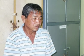 Đối tượng Trần Văn Hải tại cơ quan điều tra. (Ảnh: TTXVN phát)