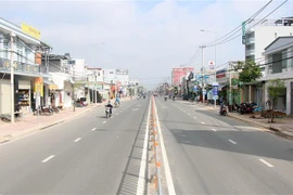 Đường Tô Ký được mở rộng lên 4 làn xe, với mặt cắt ngang rộng 25m, giúp giao thông về Hóc Môn được thuận lợi. (Ảnh: Tiến Lực/TTXVN)