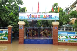 Mưa lớn gây ngập lụt ở địa bàn xã Vĩnh Thạnh, thành phố Nha Trang, tỉnh Khánh Hòa. (Ảnh: Phan Sáu/TTXVN)