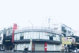 Vợ Phan Văn Anh Vũ khiếu nại việc thi hành án nhà, đất tại 319 Lê Duẩn. (Ảnh: Kim Anh/Vietnam+)