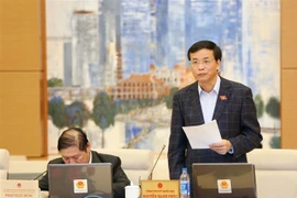 Tổng Thư ký Quốc hội Nguyễn Hạnh Phúc trình bày các báo cáo Tổng kết Kỳ họp thứ 6 và cho ý kiến bước đầu về việc chuẩn bị Kỳ họp thứ 7 của Quốc hội. (Ảnh: Dương Giang/TTXVN)
