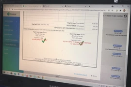 Hóa đơn điện tử có tích xanh mới được xác nhận là đăng ký thành công. (Ảnh: Thanh Vân/TTXVN)