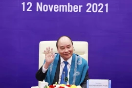 Chủ tịch nước Nguyễn Xuân Phúc dự Hội nghị các nhà Lãnh đạo kinh tế APEC lần thứ 28 được tổ chức theo hình thức trực tuyến. (Ảnh: Thống Nhất/TTXVN)
