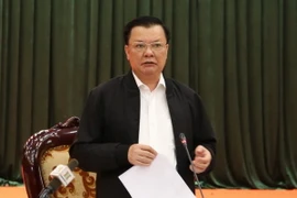 Bí thư Thành ủy Đinh Tiến Dũng phát biểu tại buổi làm việc với Ban Thường vụ Huyện ủy Ba Vì. (Ảnh: TTXVN)