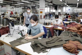 May hàng xuất khẩu sang thị trường Mỹ. (Ảnh: Trần Việt/TTXVN)