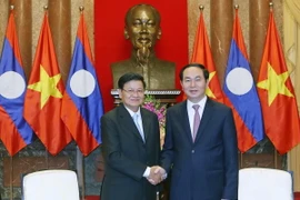 Chủ tịch nước Trần Đại Quang tiếp Thủ tướng Chính phủ Lào Thongloun Sisoulith đang thăm hữu nghị chính thức Việt Nam. (Ảnh: Nhan Sáng-TTXVN)