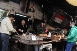 Người dân Syria trở lại hoạt động thường nhật tại Damascus ngày 27/2, sau khi lệnh ngừng bắn có hiệu lực. (Nguồn: THX/TTXVN)