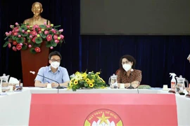 Phó Thủ tướng Vũ Đức Đam làm việc với Trung tâm An sinh Thành phố Hồ Chí Minh. (Ảnh: TTXVN phát)