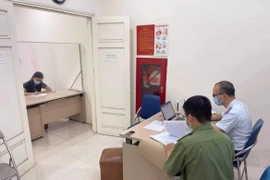 Bà P.T.N.M bị triệu tập làm việc với cơ quan chức năng để làm rõ hành vi giả mạo logo, thương hiệu T&T Group trên mạng xã hội. (Nguồn: Vietnam+)
