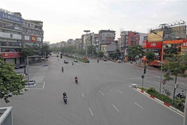 Ngã ba Xã Đàn-Phạm Ngọc Thạch không đông như thường thấy. (Ảnh: Trần Việt/TTXVN)