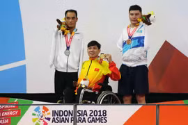 Vận động viên Võ Thanh Tùng giành Huy chương Vàng tại Asian Para Games. (Ảnh: Tấn Phúc/Vietnam+)