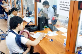 Công tác chi trả trợ cấp thất nghiệp được thực hiện song song với phòng ngừa thất nghiệp và giúp người lao động quay trở lại thị trường lao động. (Ảnh minh hoạ: PV/Vietnam+)