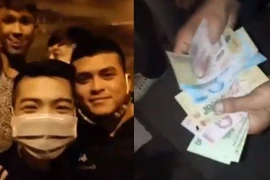 Nhóm thanh niên chặn đường xin đểu xe trên cao tốc (Ảnh: Cắt từ Clip. Nguồn: Facebook) 