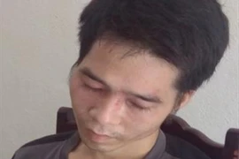 Đối tượng Vi Văn Đông bị lực lượng chức năng bắt giữ. (Ảnh: TTXVN phát)