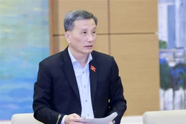 Chủ nhiệm Ủy ban Khoa học, Công nghệ và Môi trường Lê Quang Huy trình bày báo cáo. (Ảnh: Doãn Tấn/TTXVN)