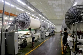 Hoạt động tại một doanh nghiệp ở Long An. (Ảnh: TTXVN)