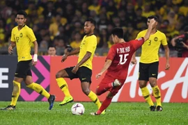 Pha ghi bàn của cầu thủ Việt Nam Phạm Đức Huy vào lưới Malaysia trong trận lượt đi chung kết AFF Suzuki Cup 2018, Kuala Lumpur, Malaysia ngày 11/12. (Nguồn: AFP/TTXVN)