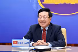 Phó Thủ tướng, Bộ trưởng Ngoại giao Phạm Bình Minh hội đàm trực tuyến với Phó Thủ tướng, Bộ trưởng Ngoại giao Thái Lan Don Pramudwinai. (Ảnh: TTXVN phát)